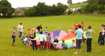 Children playing with parachute